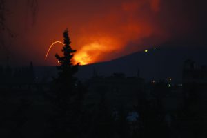Fire and explosions are seen in what purported to be the Mountain 47 region, countryside south of Hama city